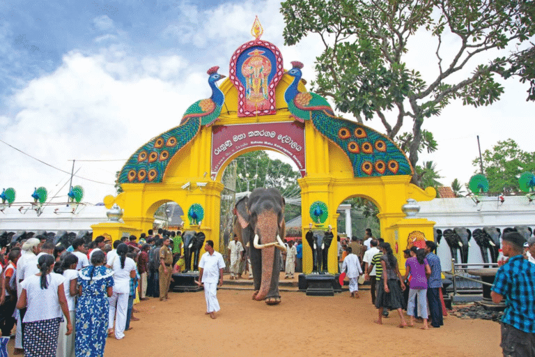 Front view of Kataragama Devalaya temple in Sri Lanka with devotees offering flowers and lanterns